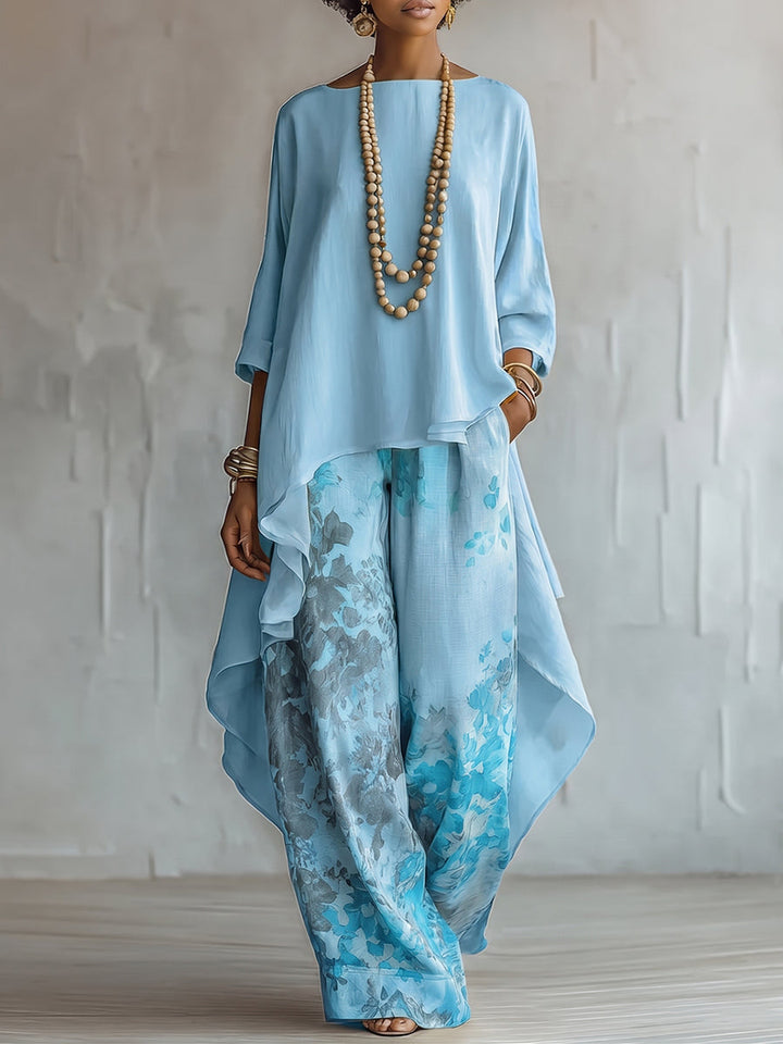 Set Top Asimmetrico Blu e Pantaloni a Gamba Larga con Fantasia Floreale
