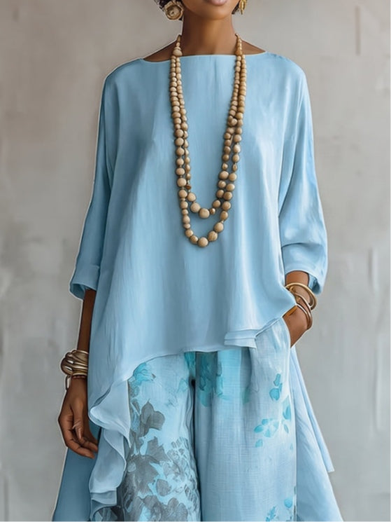 Set Top Asimmetrico Blu e Pantaloni a Gamba Larga con Fantasia Floreale