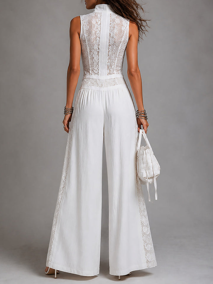 Tuta vintage con colletto alto e gamba ampia con pannelli in pizzo