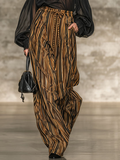 Set elegante con top nero off-the-shoulder e pantaloni larghi a righe