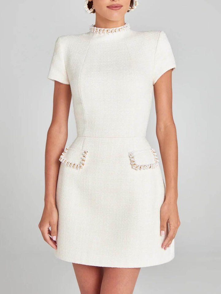 Abito Mini con Tasche e Bordo di Perle Elegante e Giocoso