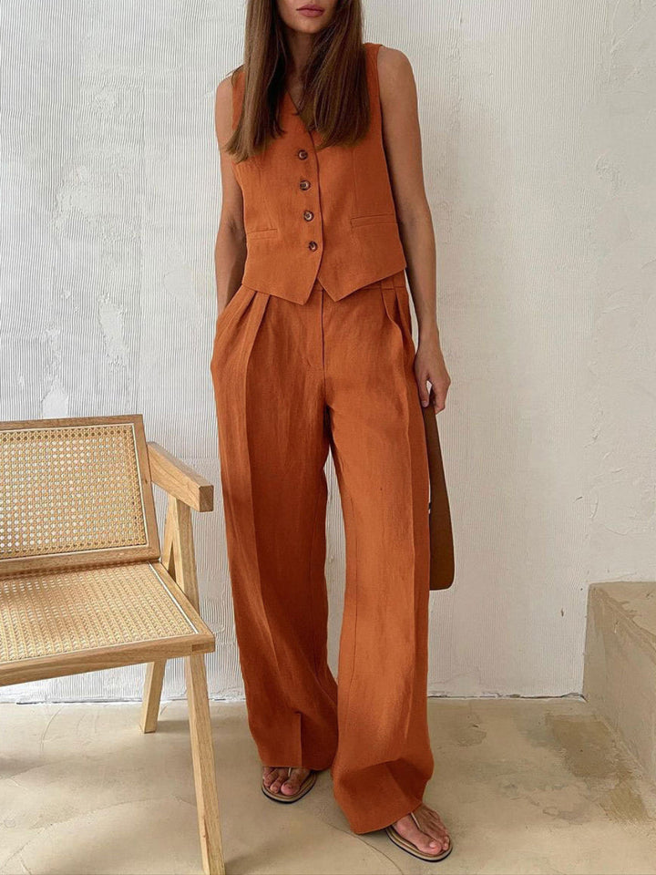 Pantaloni a gamba larga plissettati in cotone e lino con scollo a V classico