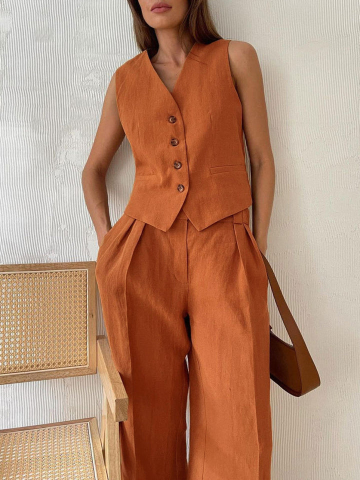 Pantaloni a gamba larga in cotone e lino plissettati con scollo a V