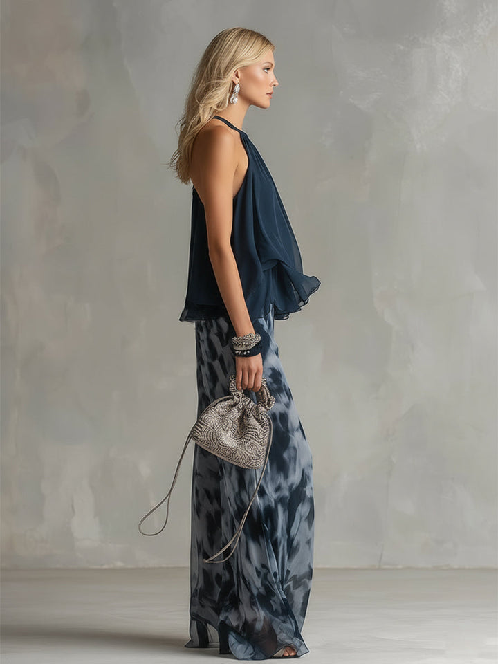 Chloé | Completo elegante con top a schiena nuda blu navy e pantaloni larghi stampati