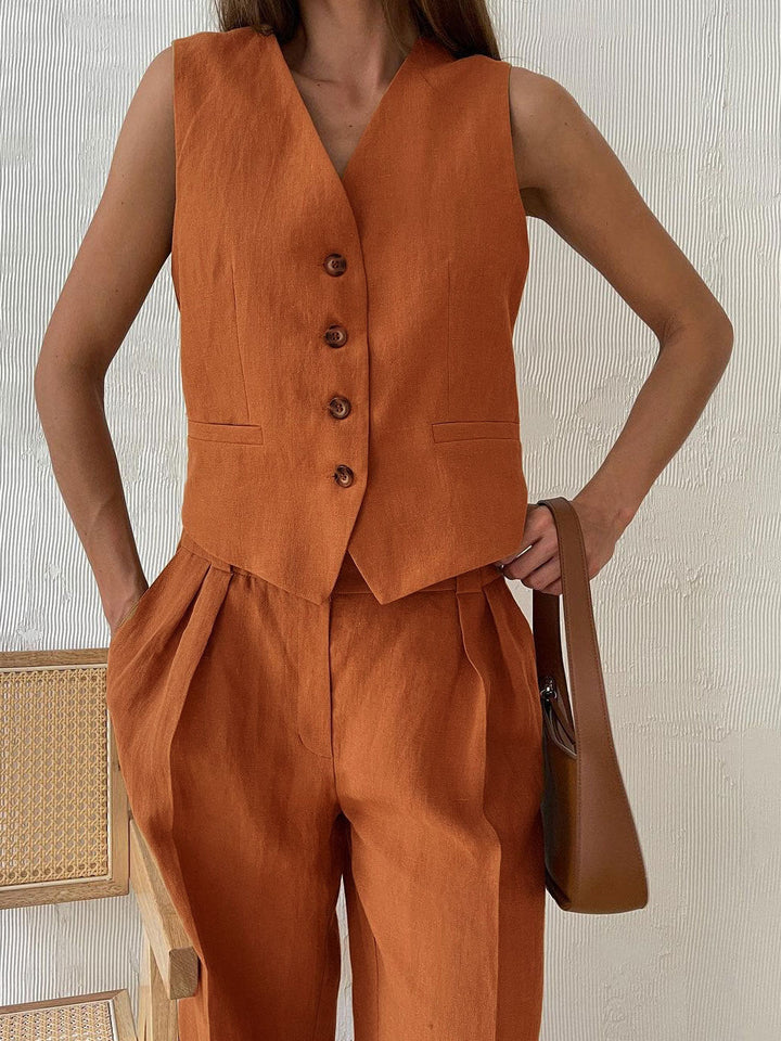 Pantaloni a gamba larga in cotone e lino plissettati con scollo a V