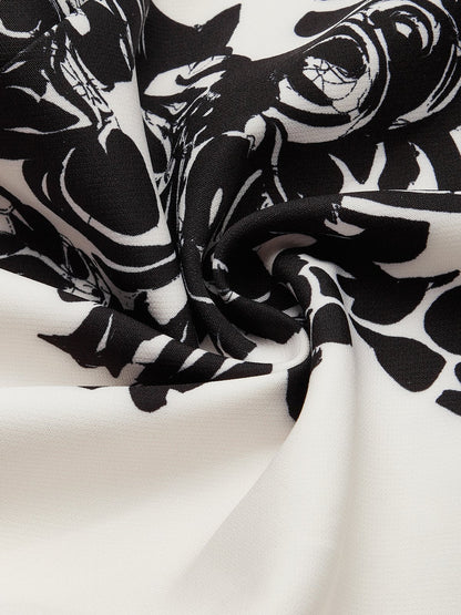 Salopette Harem Vintage Floreale Nero e Bianco con Spalla Scoperta e Tasche