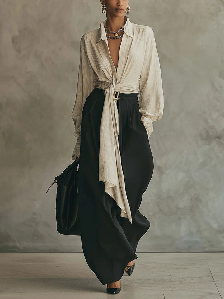Set camicia beige con lacci e pantaloni neri