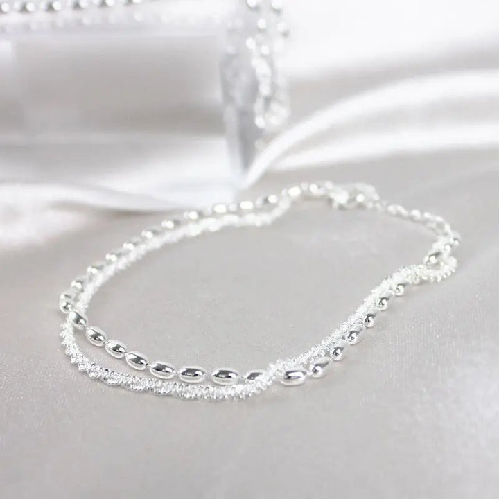 Set di bracciali eleganti in argento con pietre di zirconio