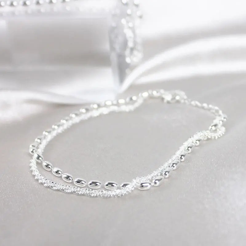 Set di bracciali eleganti in argento con pietre di zirconio