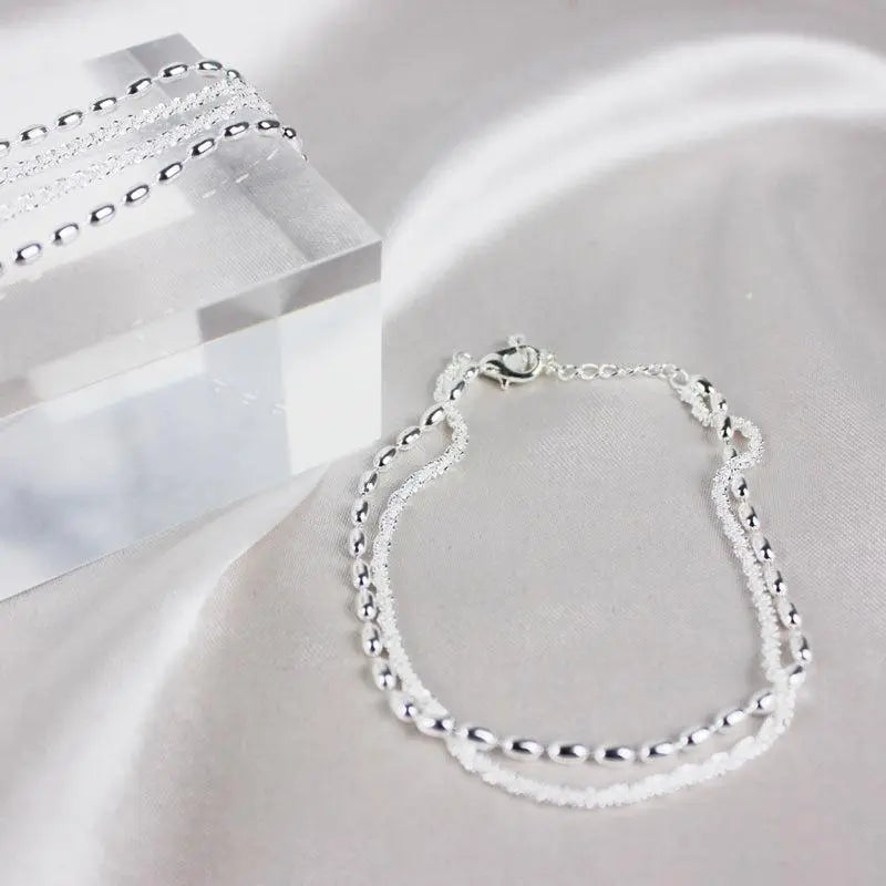 Set di bracciali eleganti in argento con pietre di zirconio