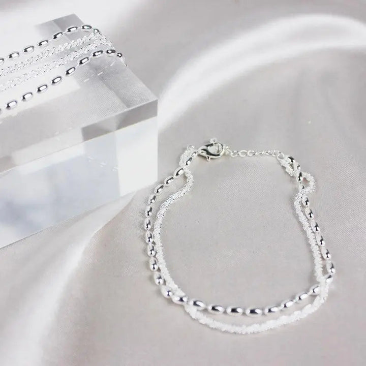 Set di bracciali eleganti in argento con pietre di zirconio