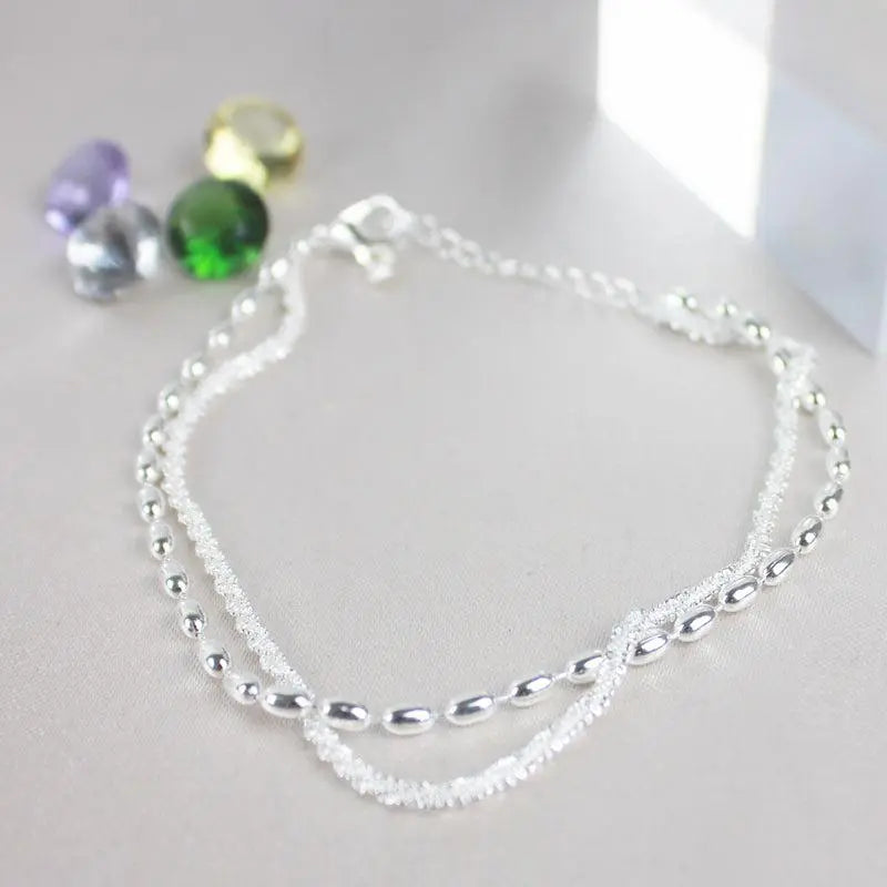 Set di bracciali eleganti in argento con pietre di zirconio