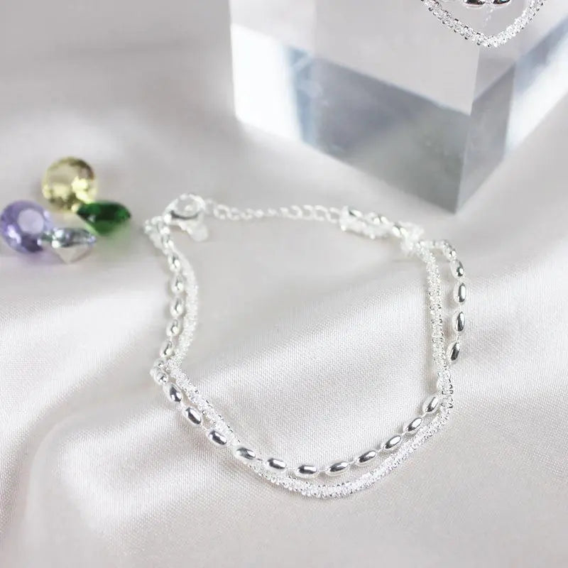 Set di bracciali eleganti in argento con pietre di zirconio