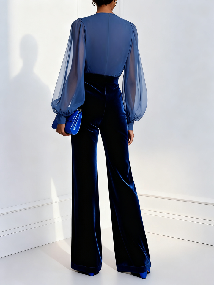 Tuta in velluto blu con scollo a V e maniche lunghe