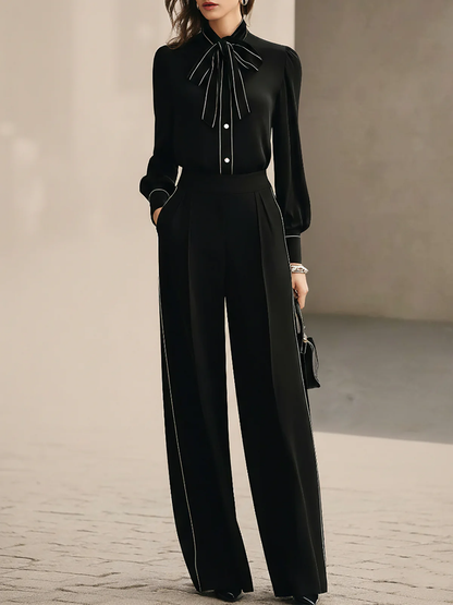 Blusa con Papillon Trimmato in Bianco e Nero e Pantaloni a Gamba Larga Set di Due Pezzi