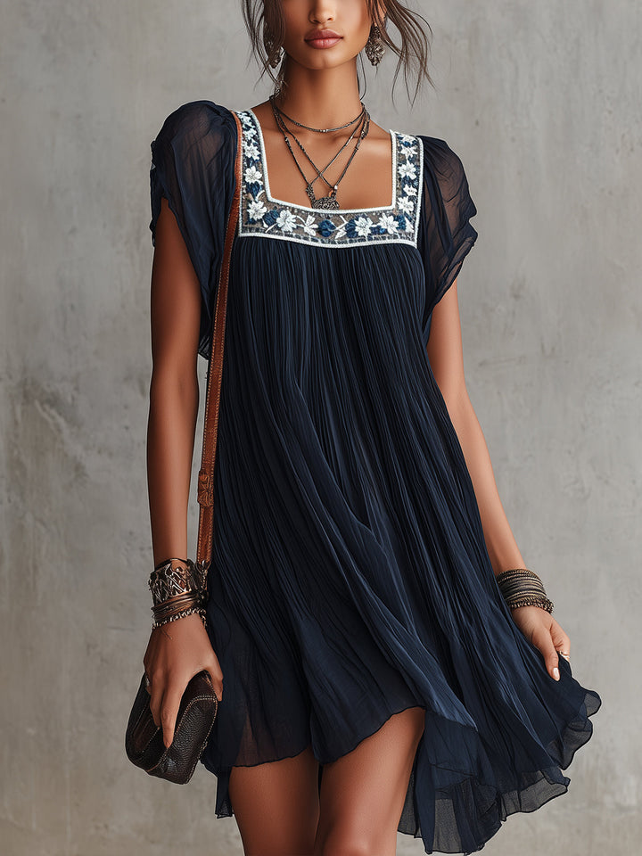 Abito mini in chiffon plissettato ricamato floreale blu navy