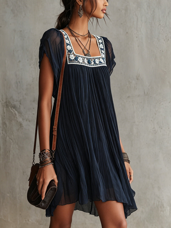 Abito mini in chiffon plissettato ricamato floreale blu navy
