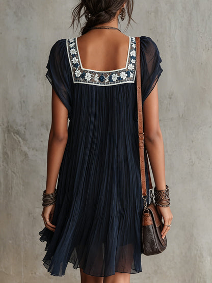 Abito mini in chiffon plissettato ricamato floreale blu navy