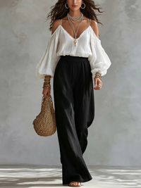 Top Bianco Senza Spalline e Pantaloni Neri a Gamba Larga