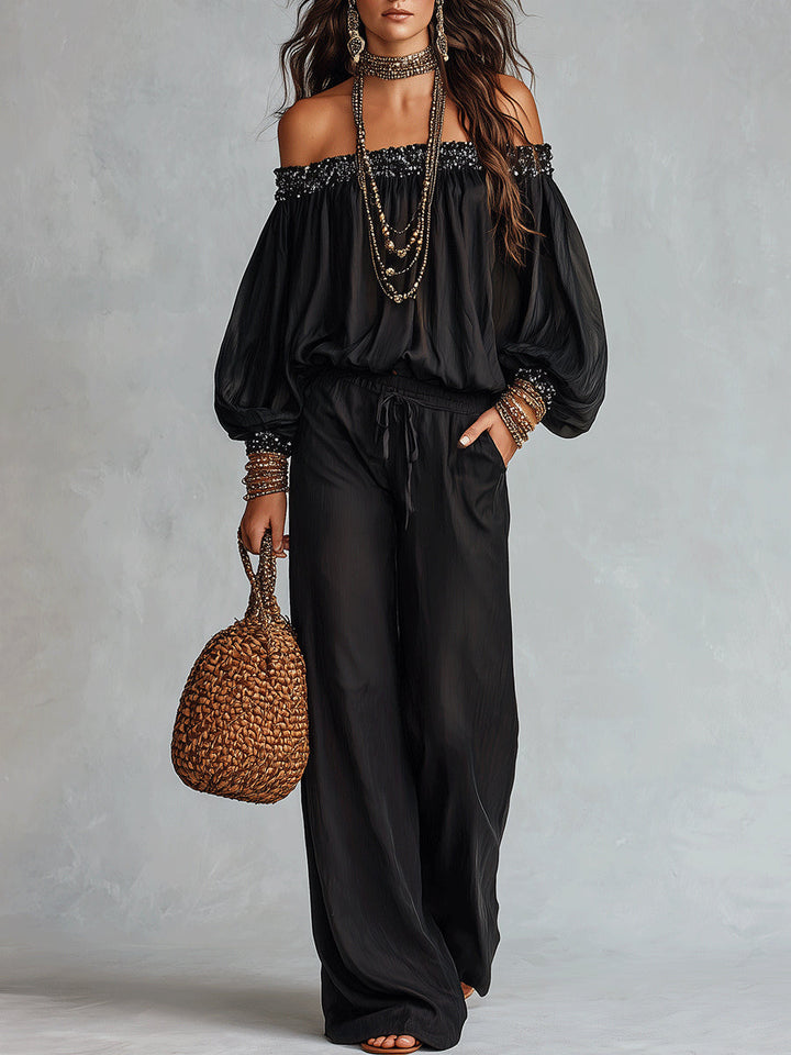 Top Nero Off-the-shoulder Con Paillettes Abbinato A Pantaloni Larghi Con Coulisse