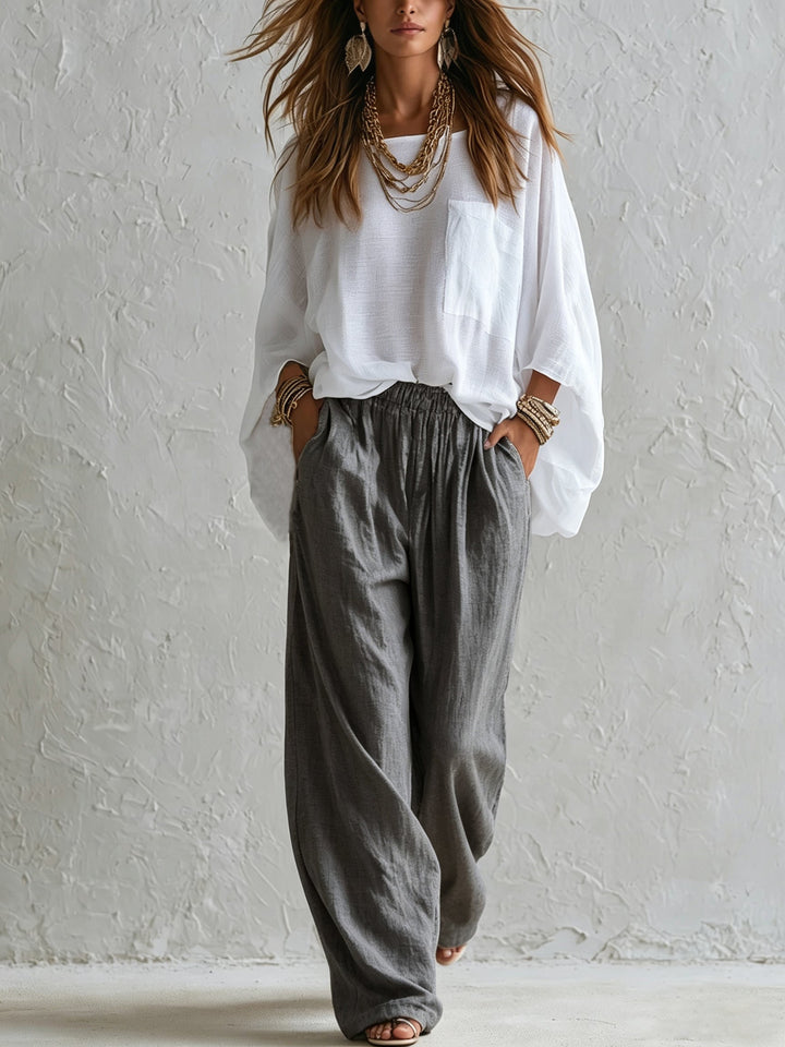 Completo Top Bianco Lungo e Pantaloni Grigi a Vita Alta a Gamba Larga