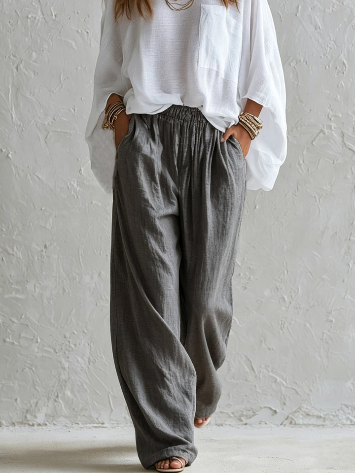 Completo con Top Bianco Largo e Pantaloni Grigi a Vita Elastico a Gamba Larga