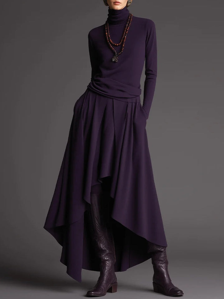 Set di due pezzi con maglione a collo alto viola e gonna asimmetrica