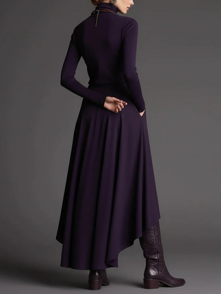 Set di due pezzi con maglione a collo alto viola e gonna asimmetrica