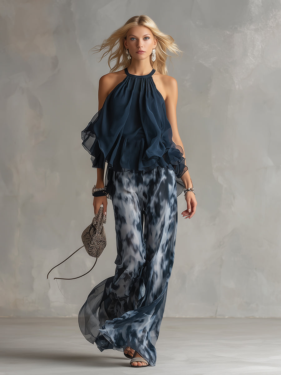 Chloé | Completo elegante con top a schiena nuda blu navy e pantaloni larghi stampati
