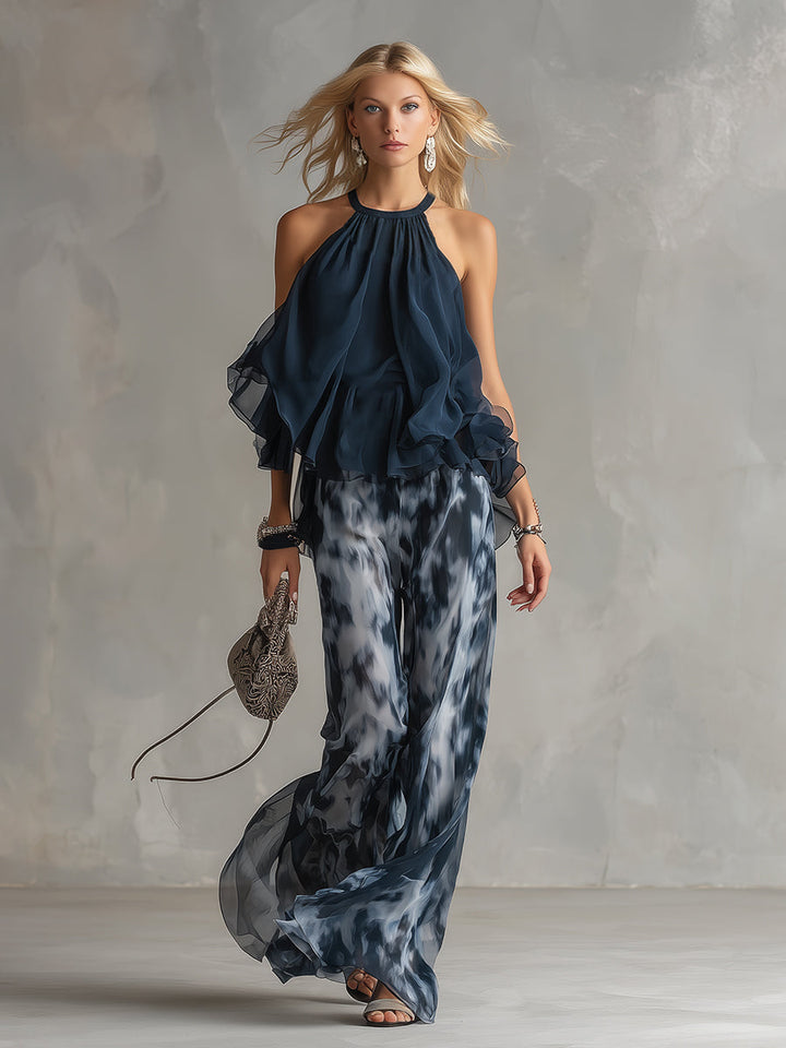 Chloé | Completo elegante con top a schiena nuda blu navy e pantaloni larghi stampati