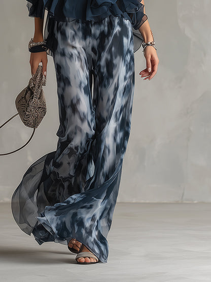 Chloé | Completo elegante con top a schiena nuda blu navy e pantaloni larghi stampati